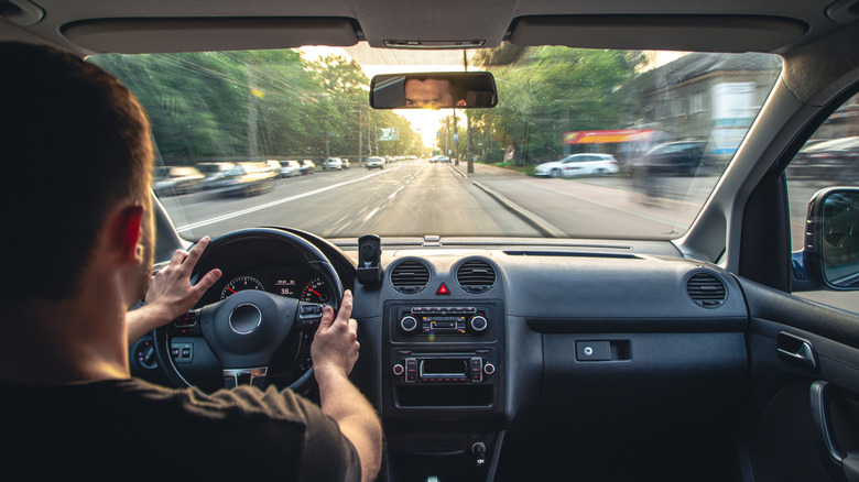 Man has hands on the wheel when driving at high speed