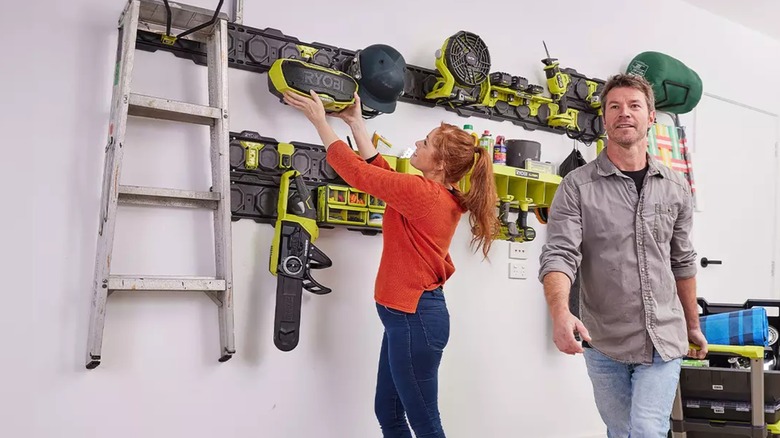 Couple hanging Ryobi tools on wall