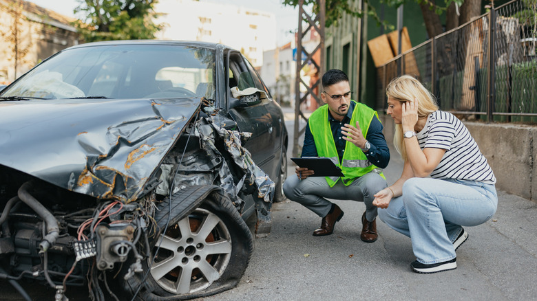 woman on phone after car crash