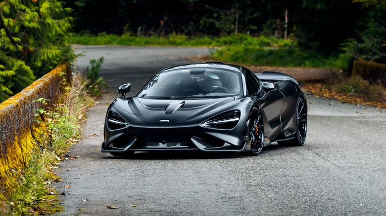 black McLaren 765LT on a forest road