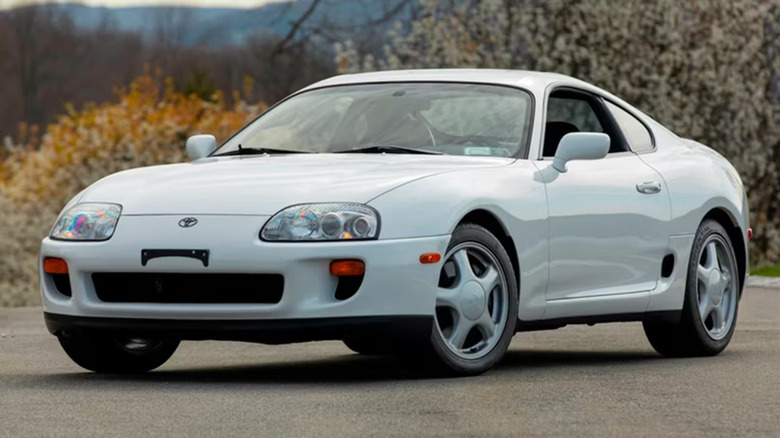 Red MK4 Supra on a cloudy day