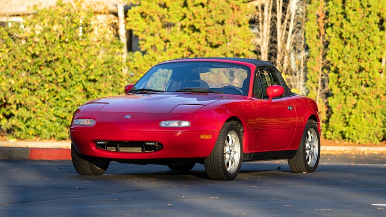 Red Mazda Miata on road