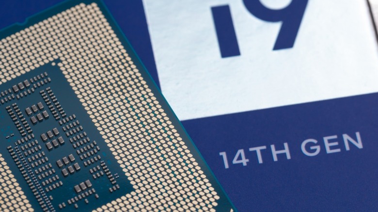 CPU chip with an i9 14th gen packaging in the background