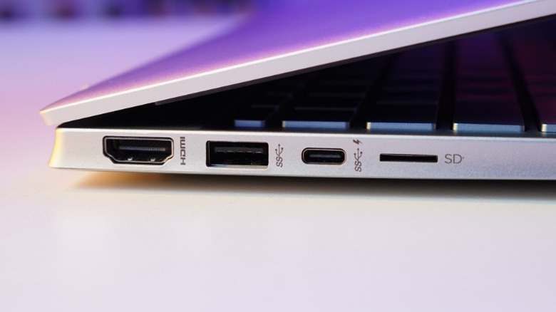 Side view of a laptop with the ports and slots shown