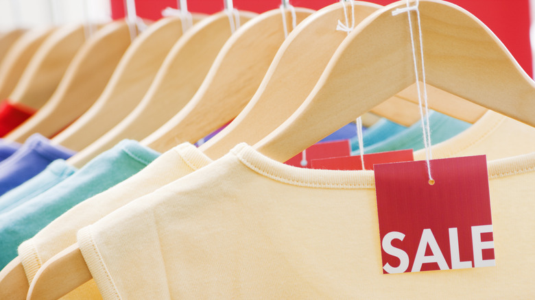 shirts hanging with sale tag