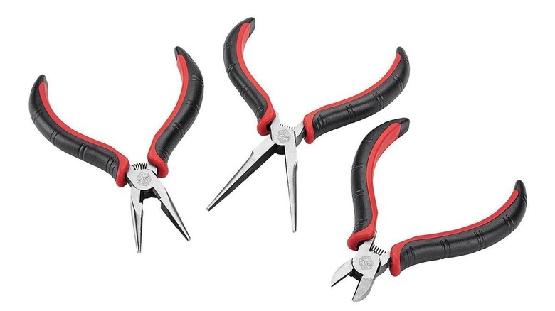 Set of pliers on white background