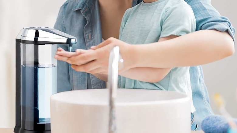 Mother and child washing hands