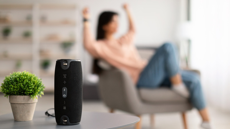 Closeup of smart portable wireless speaker on the table, selective focus