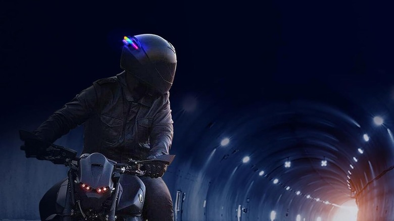 Motorcycle rider wearing a helmet