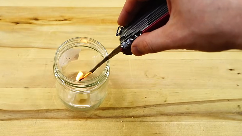 Lighting a candle in a jar using Swiss Army Knife