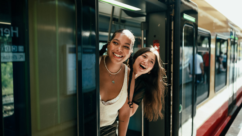 two girls riding train