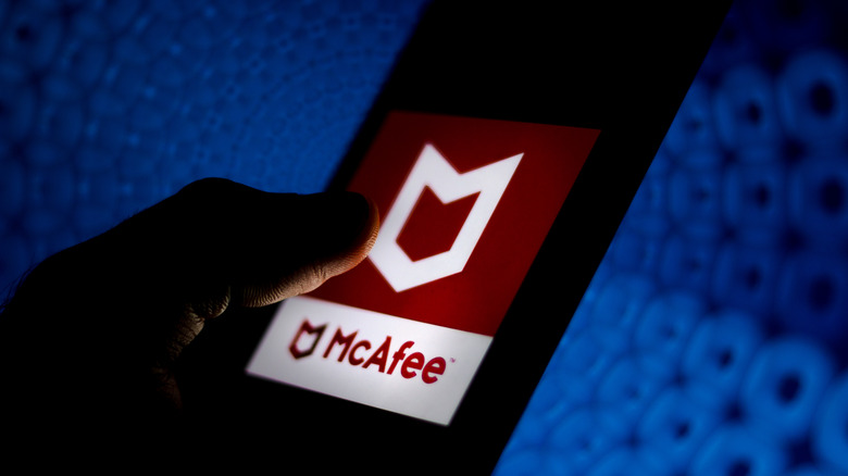 McAfee antivirus app logo displayed on a smartphone
