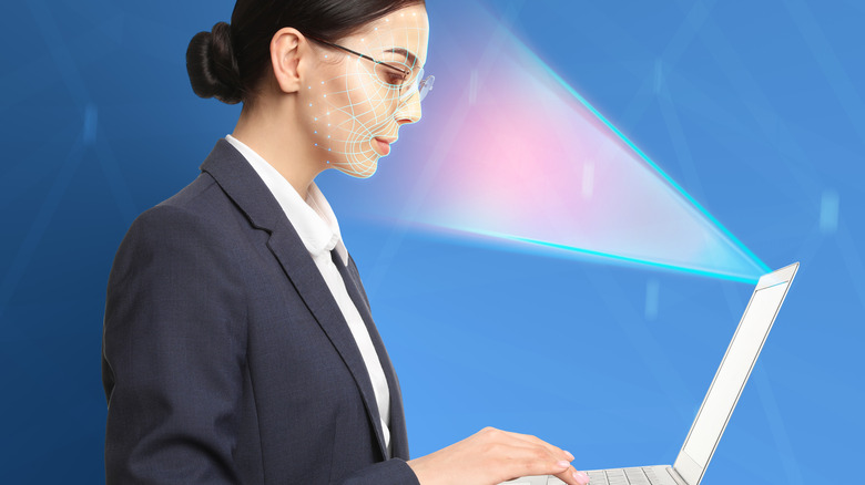laptop scanning woman's face