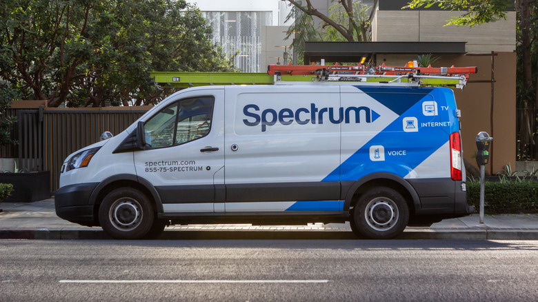 Spectrum technician van parked on street