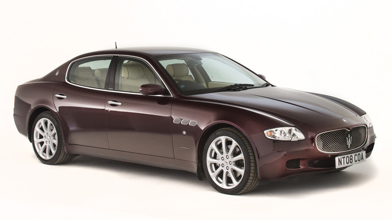 A burgundy Maserati Quattroporte, studio shot, front 3/4 view