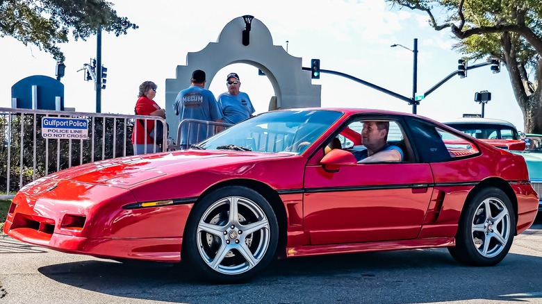 Red Pontiac Fiero GT at an outdoor event