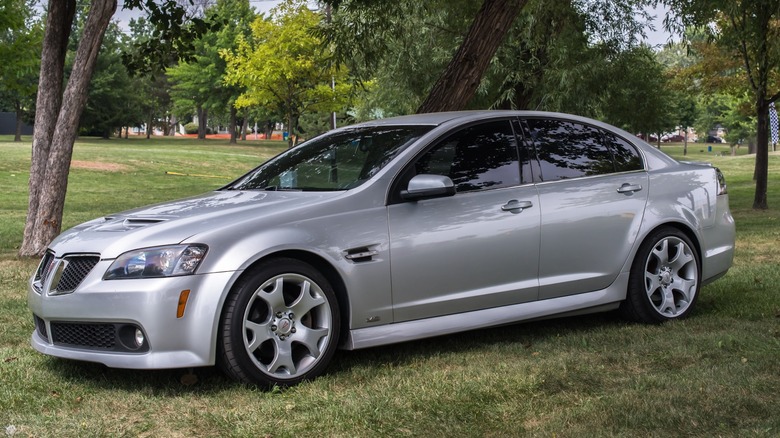 Pontiac G8 parked on grass in a park