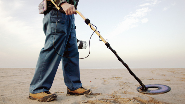 Person using a metal detector