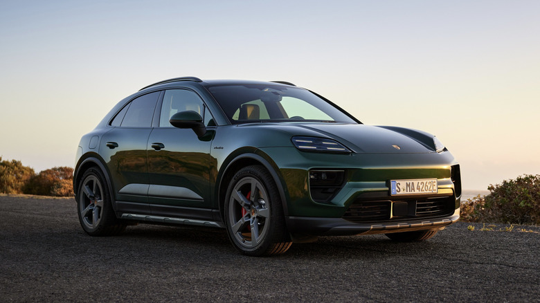 The Porsche Macan Electric in dark green, front 3/4 view