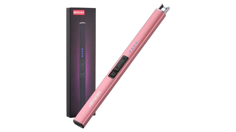 Long pink device with button and light display