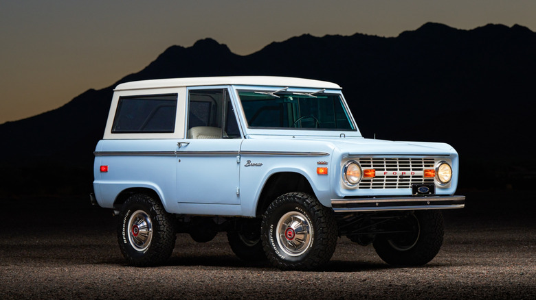 Blue 1971 Ford Bronco in front of mountain range