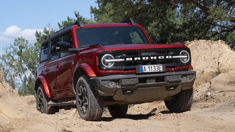 Burgundy Ford Bronco off road