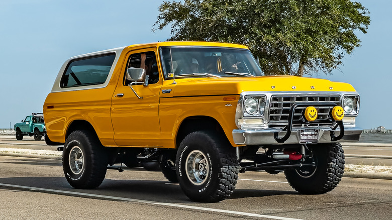 Yellow Ford Bronco driving