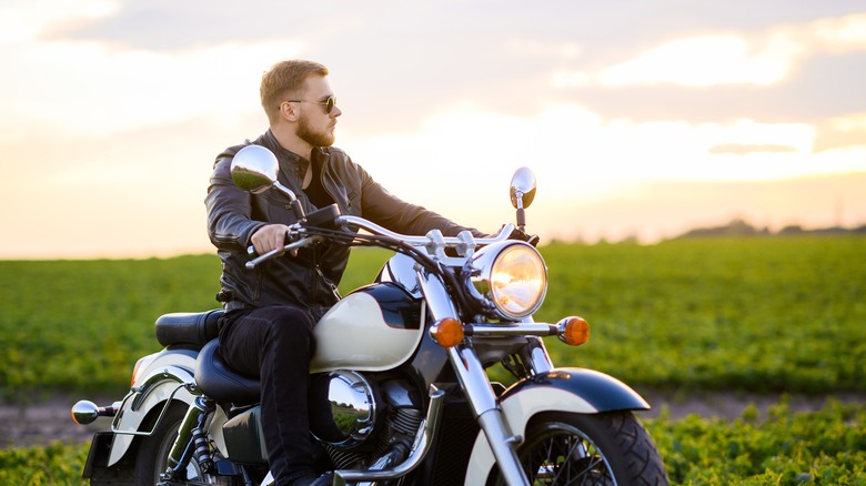 man wearing sunglasses on motorcycle