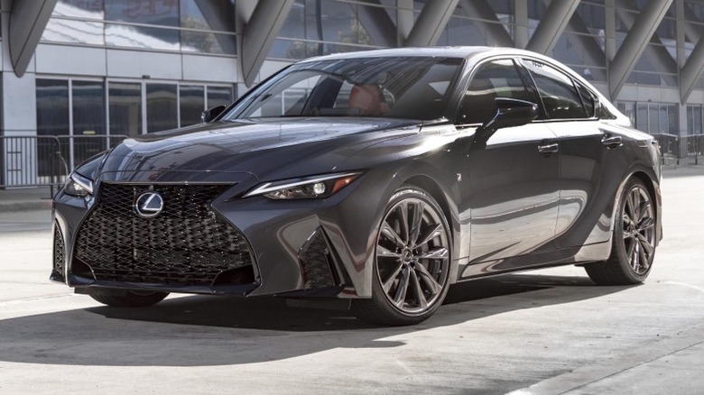 2025 Lexus IS 300 parked in front of a building