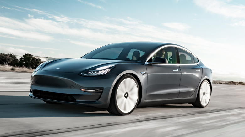 Tesla Model 3 driving quickly