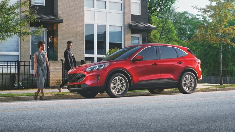 Ford Escape parked by a house