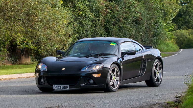 A black Lotus Europa S on the move, front 3/4 view