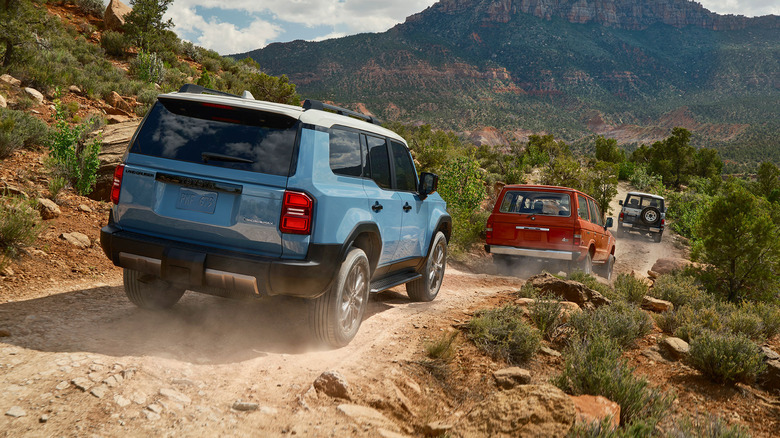 Multiple Land Cruiser generations on trail