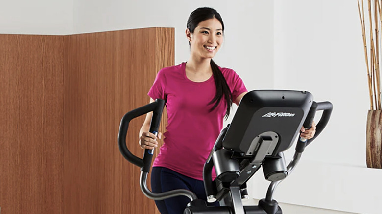 A woman exercising on the Life Fitness E5 Go