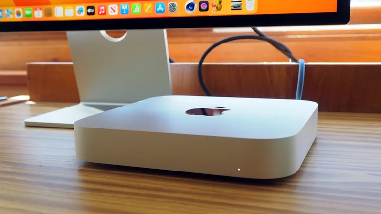 A Mac Mini M2 photographed in front of a monitor