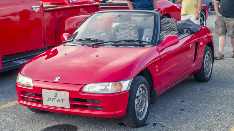 A red Honda Beat at a car meetup, front 3/4 view