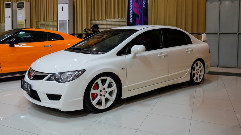 The FD2 Honda Civic Type R at a closed auto show, front 3/4 view