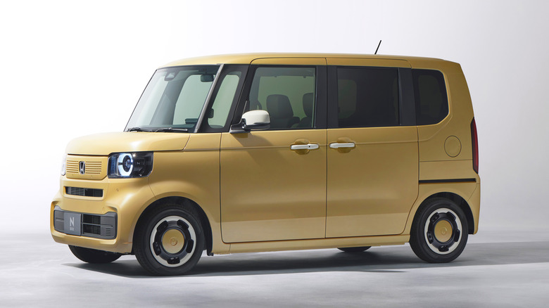 The Honda N-Box in yellow, front 3/4 view