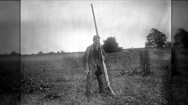 Man with punt gun