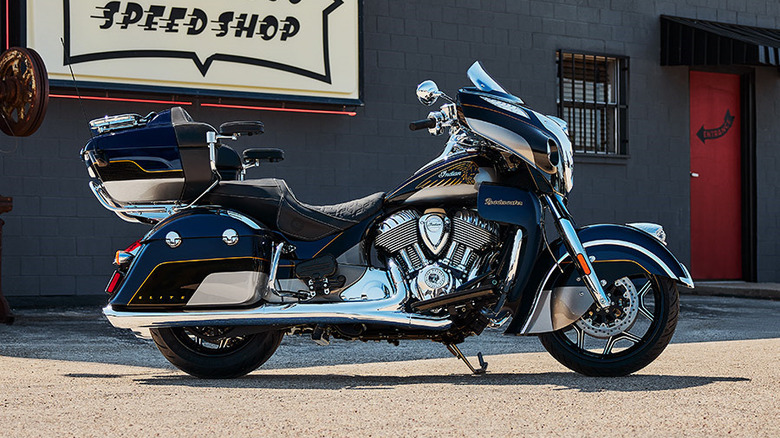 Indian Roadmaster Elite parked next to speed shop