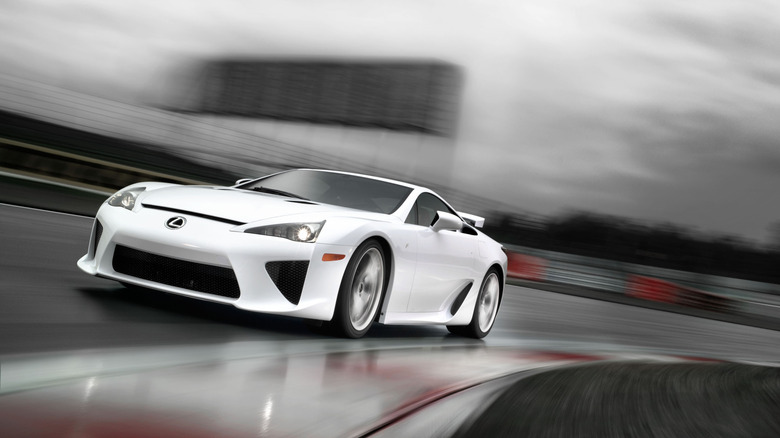 Lexus LFA cornering at speed on track front 3/4 view