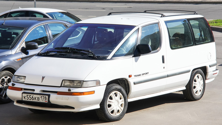 White Pontiac Trans Sport in parking lot