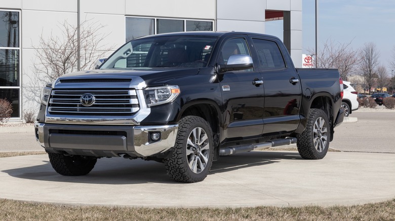 A black Toyota Tundra on a dealership lot