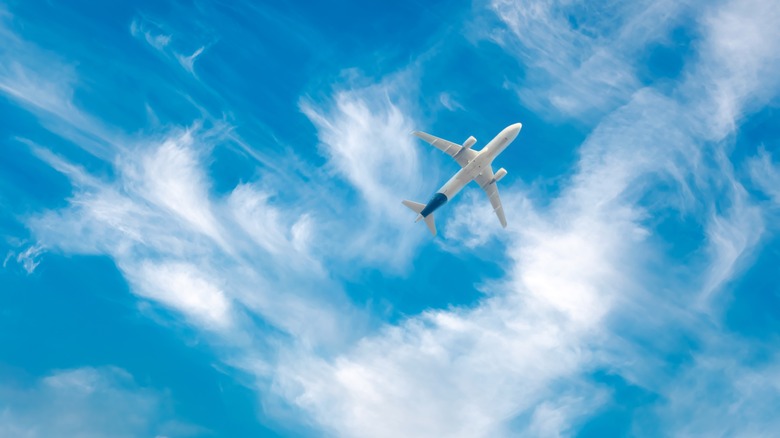 Clouds in sky with airplane