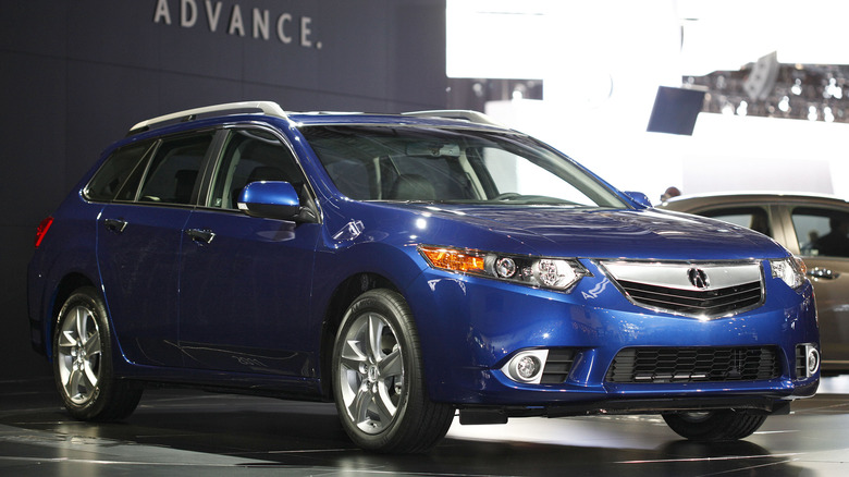 The Acura TSX wagon in blue on a show floor, front 3/4 view