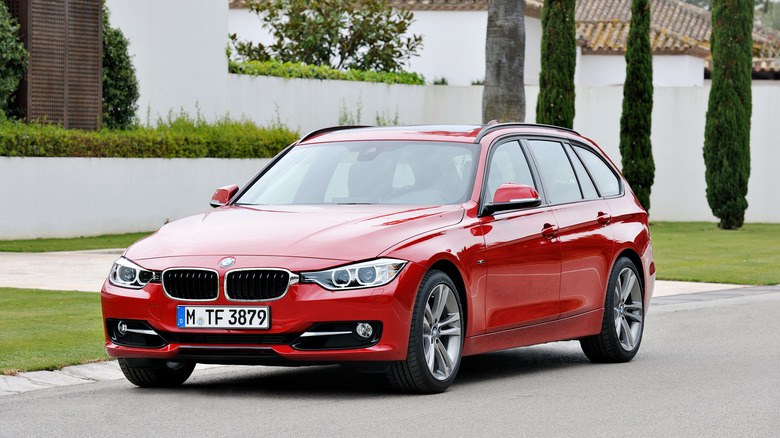 The F31 BMW 3 Series Touring in red, front 3/4 view