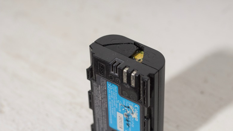 A broken battery belonging to a DSLR camera