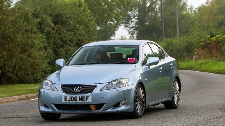 light blue Lexus IS250 on a road