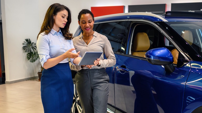 car salesperson with customer