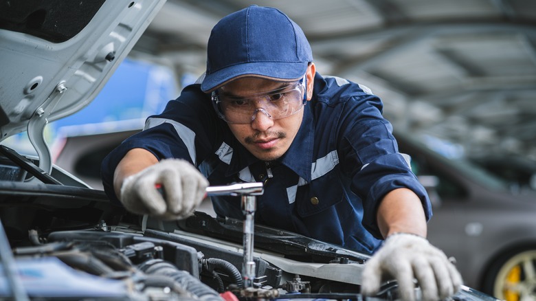 a mechanic repairing a car